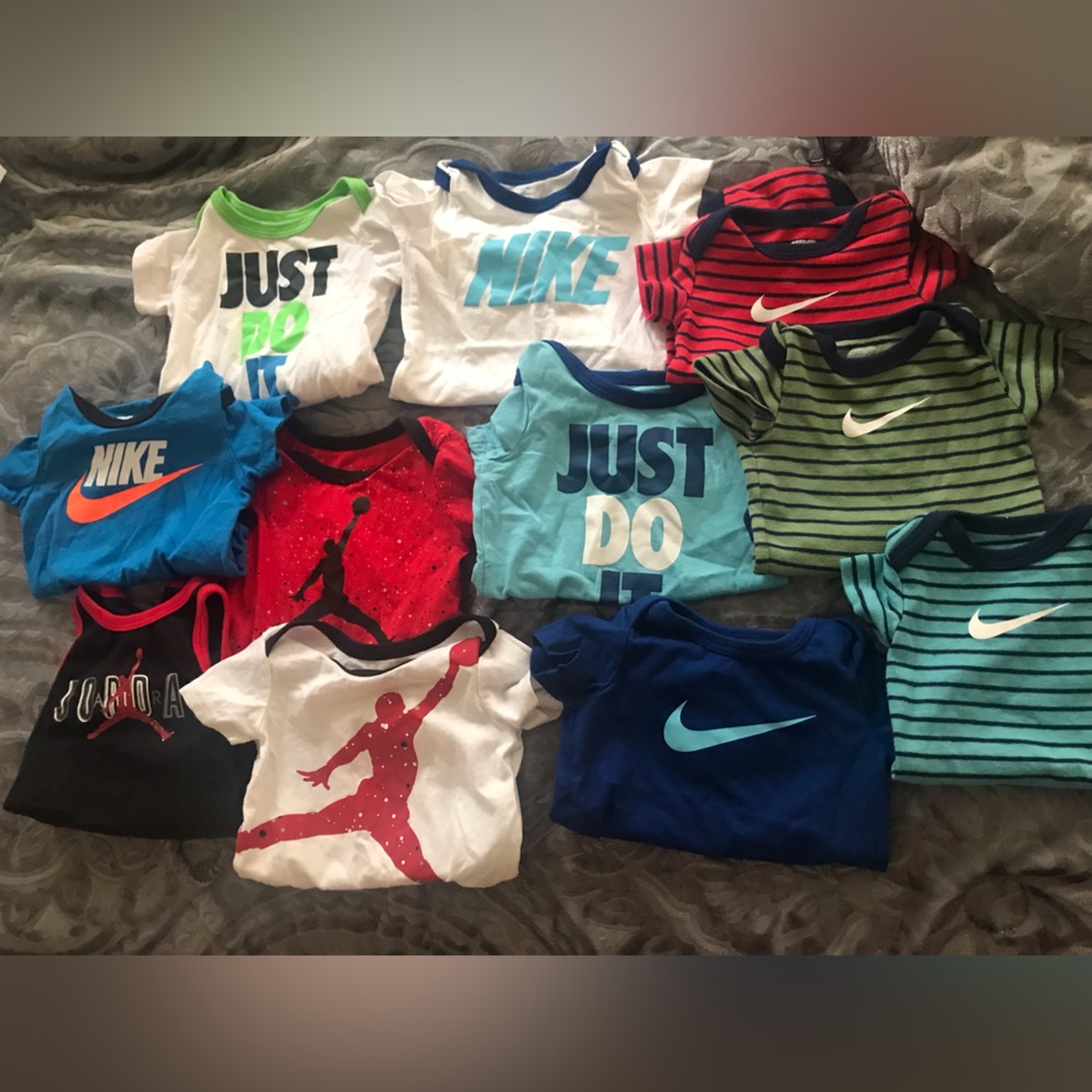 11 name brand onesies 0-3 and 3 m
